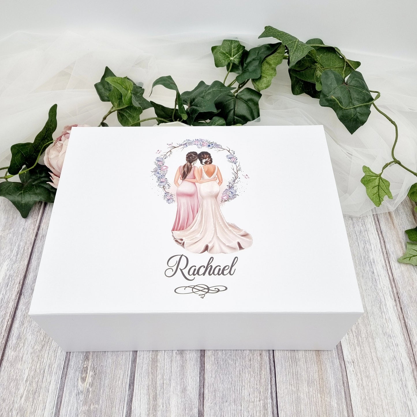 Beautiful white bridesmaid proposal gift box with bride and bridesmaid design on the front.