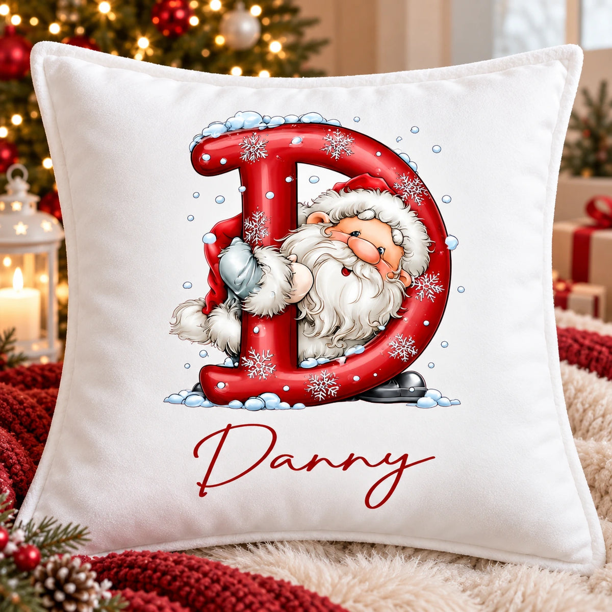 Personalised children’s white velvet Christmas cushion with festive initial, Santa and name Danny
