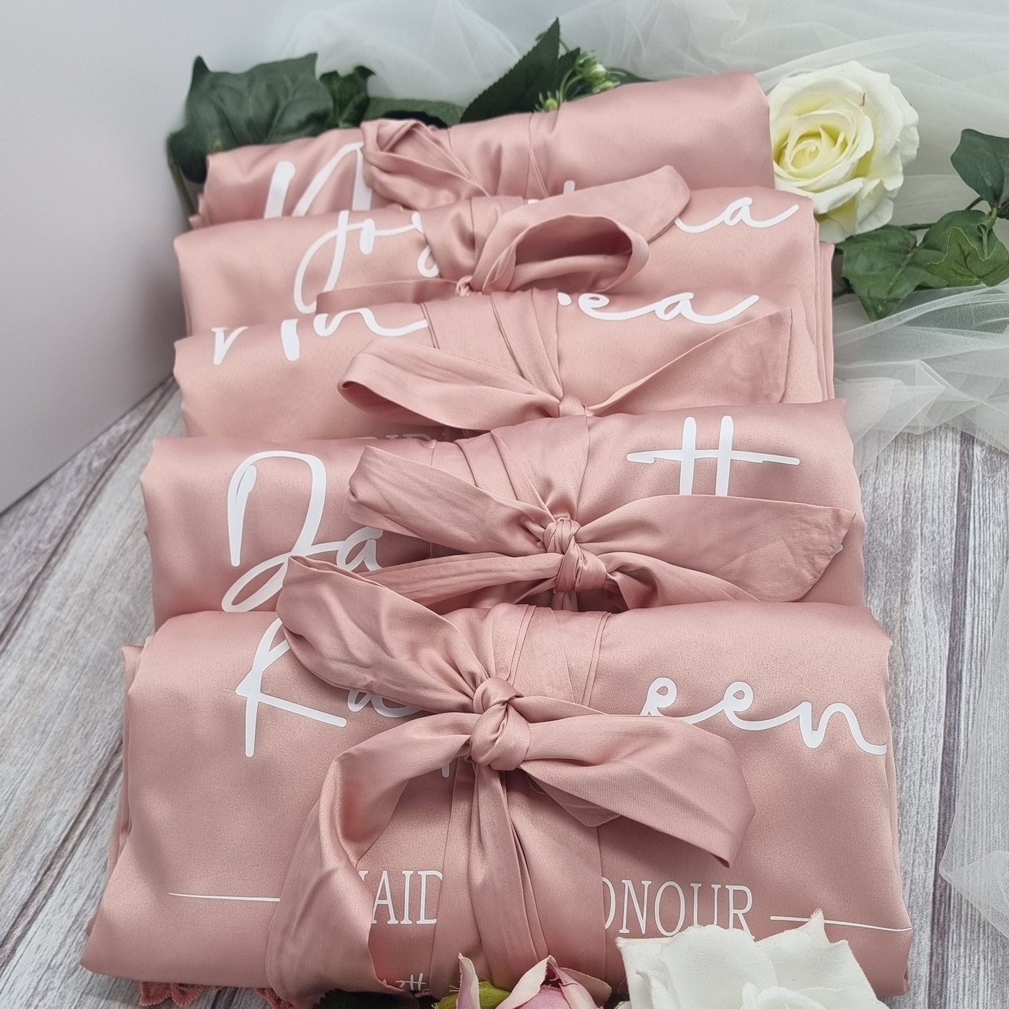 Dusty Rose pink bridal robes with white text