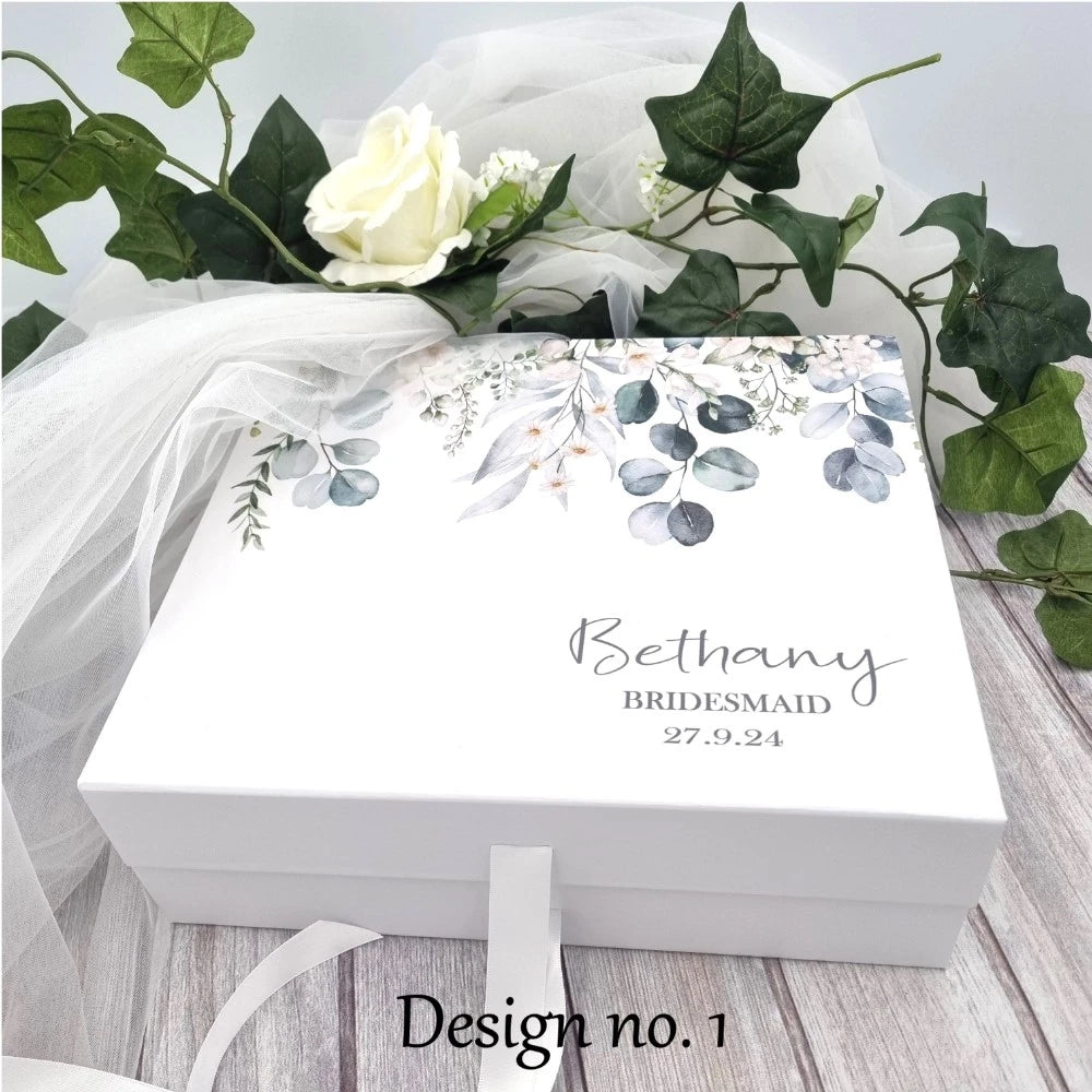 Beautiful white gift box with eucalyptus vine design and personalised with name, title and date.