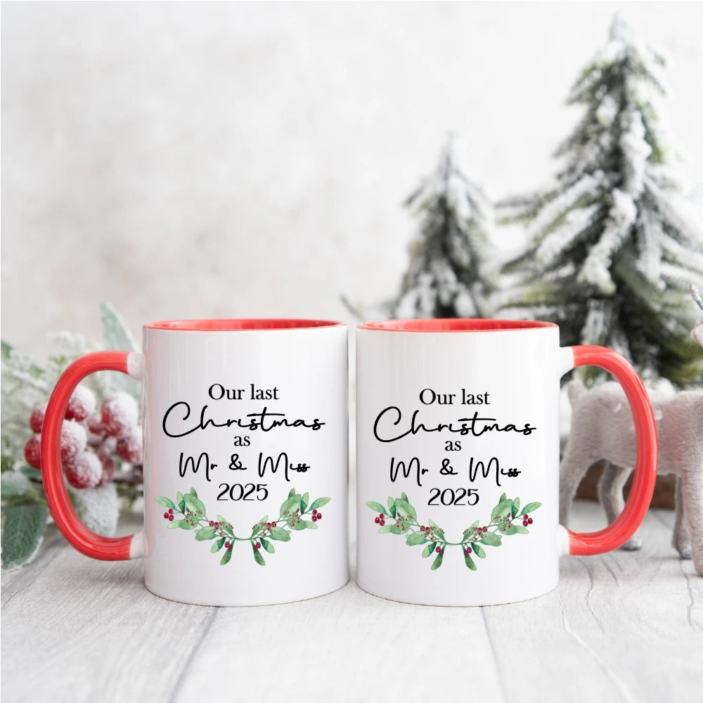 Our Last Christmas as Mr & Miss 2025 red-handled couple mug set with holly wreath, personalised Irish Christmas mugs by HanaLee Studios