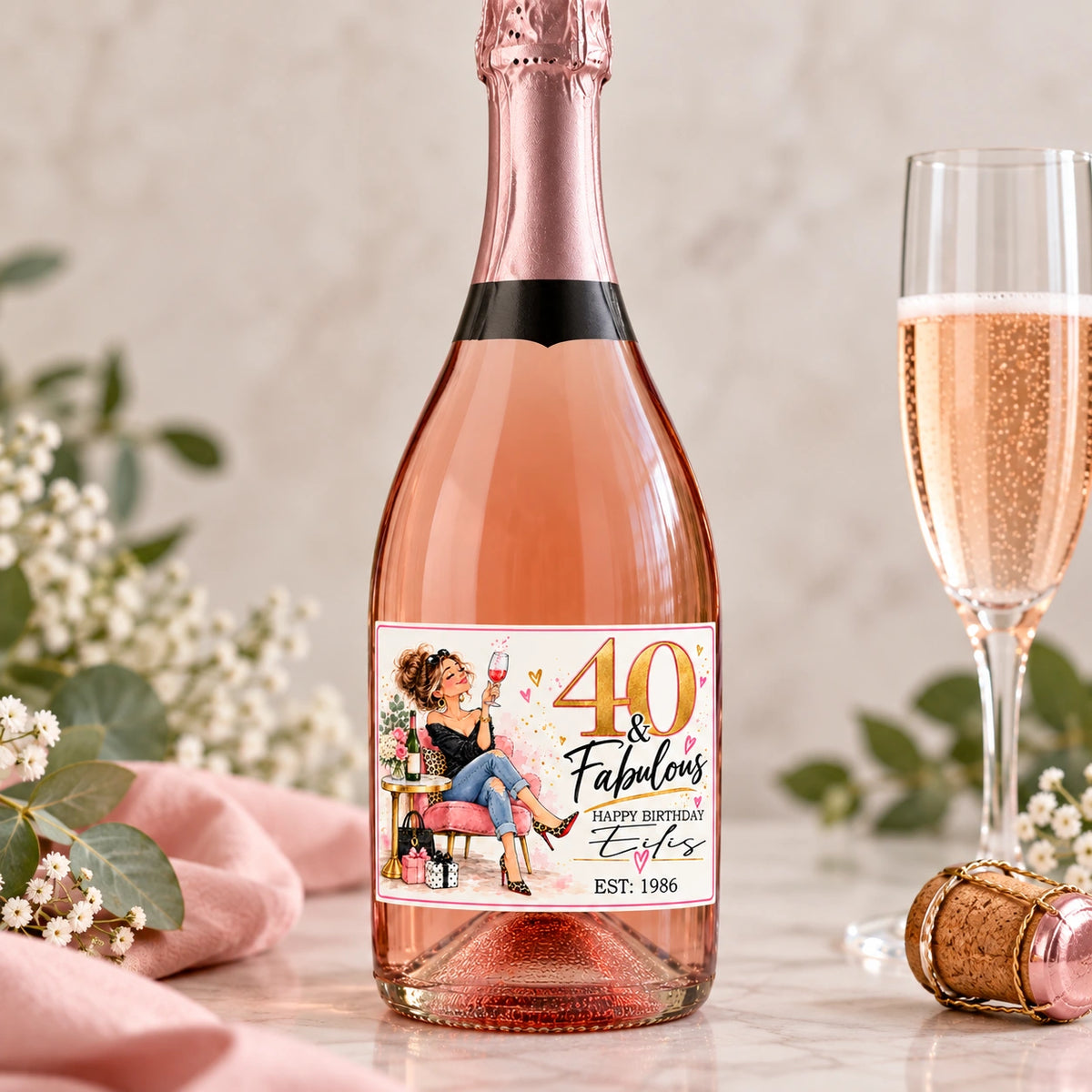 Personalised 40th birthday Prosecco bottle label featuring a Fabulous illustrated lady design, name and birth year on a rosé bottle.
