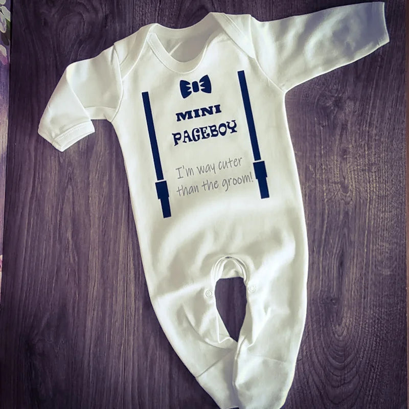 Personalised white Mini Pageboy babygrow with navy braces and bow tie design, printed and finished in Ireland by HanaLee Studios.