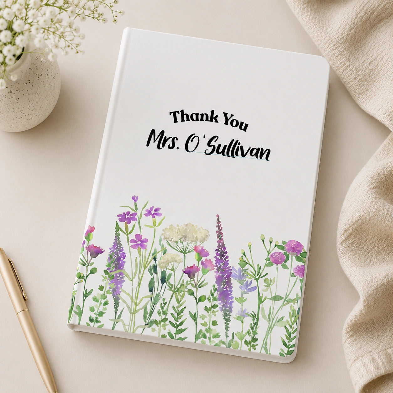 Personalised white A5 lined teacher notebook with floral design and custom teacher name printed in Ireland