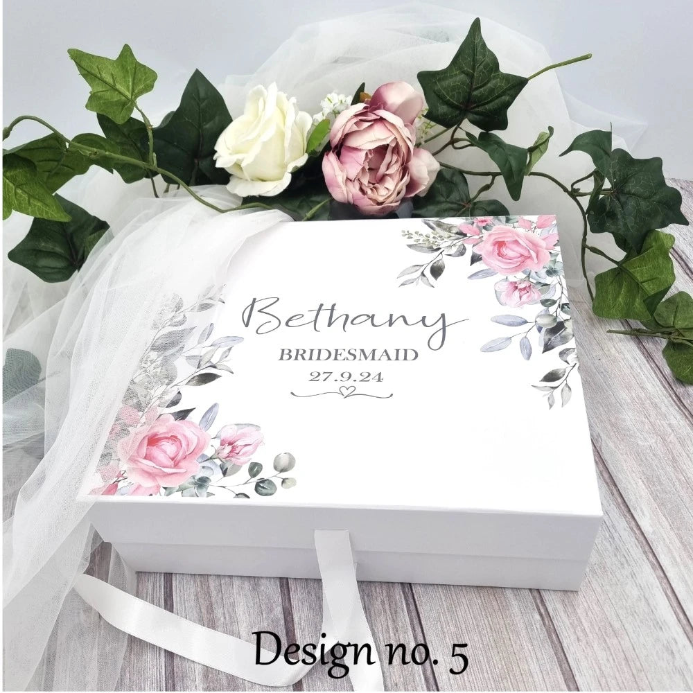Beautiful white gift box with pink dusty roses and personalised with name, date and title