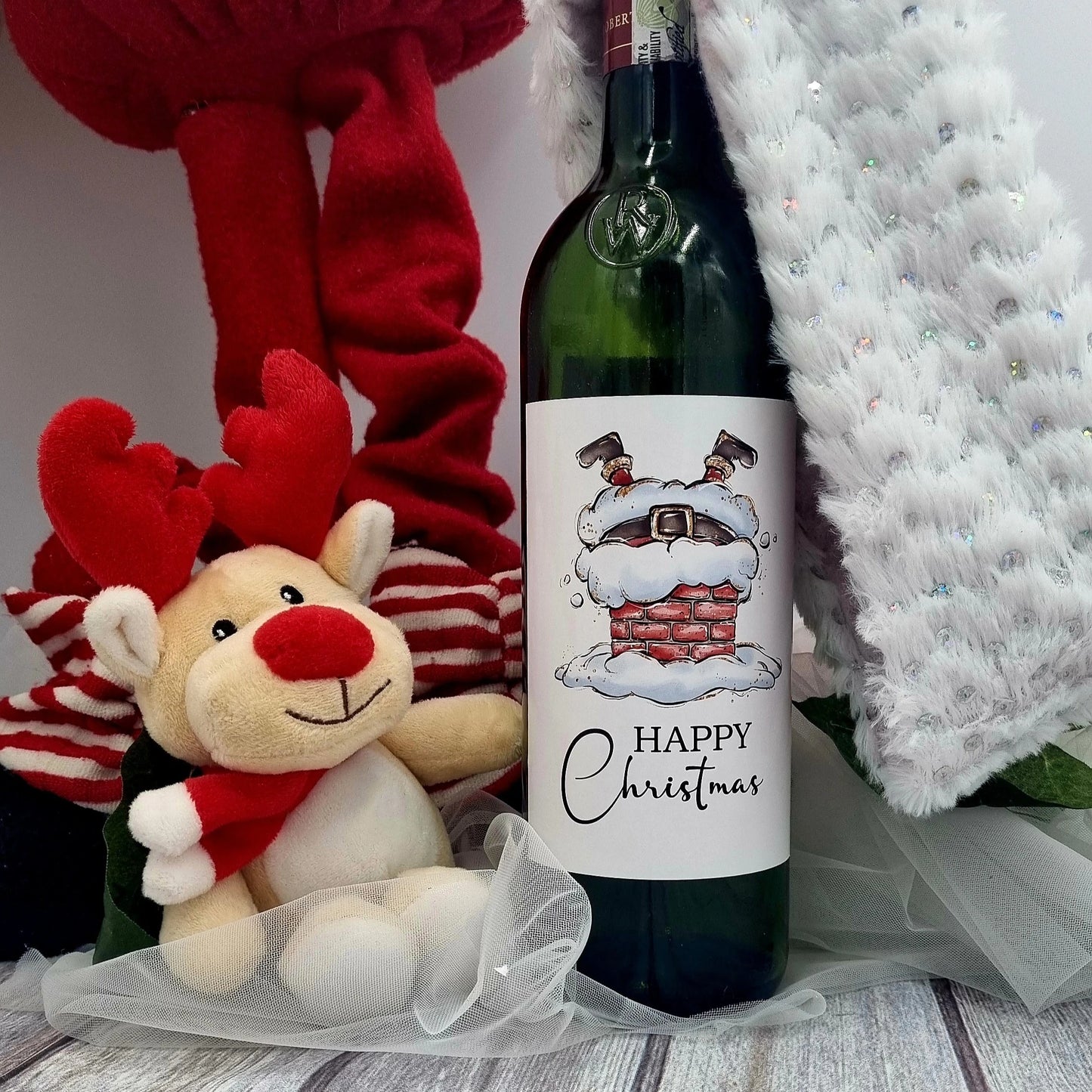 Personalised Christmas wine bottle label with Santa Legs design handmade in Ireland.