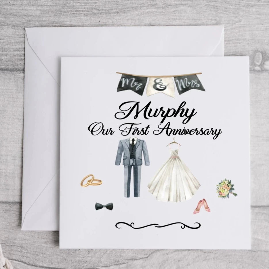 Anniversary Table cards with picture of brides dress and grooms suit