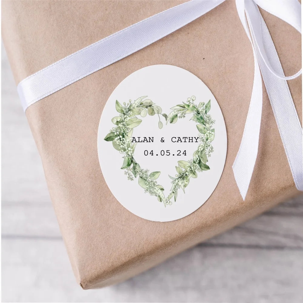 Customised wedding stickers with eucalyptus heart wreath, couples name and wedding date in the centre.