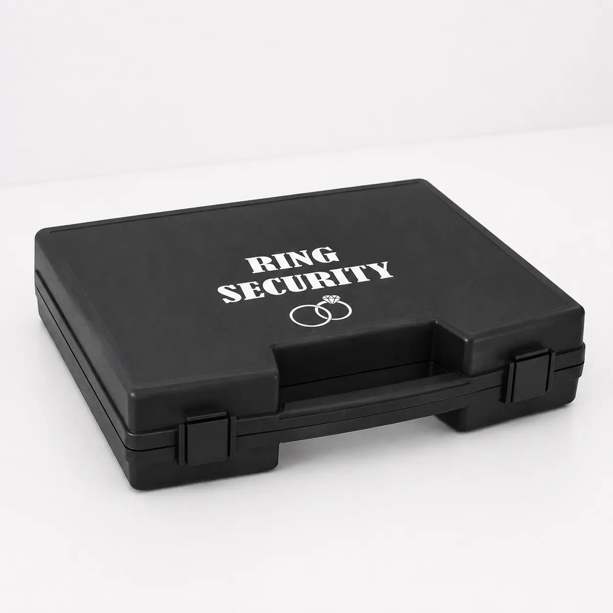Back ring security box with white text lying on a white table.
