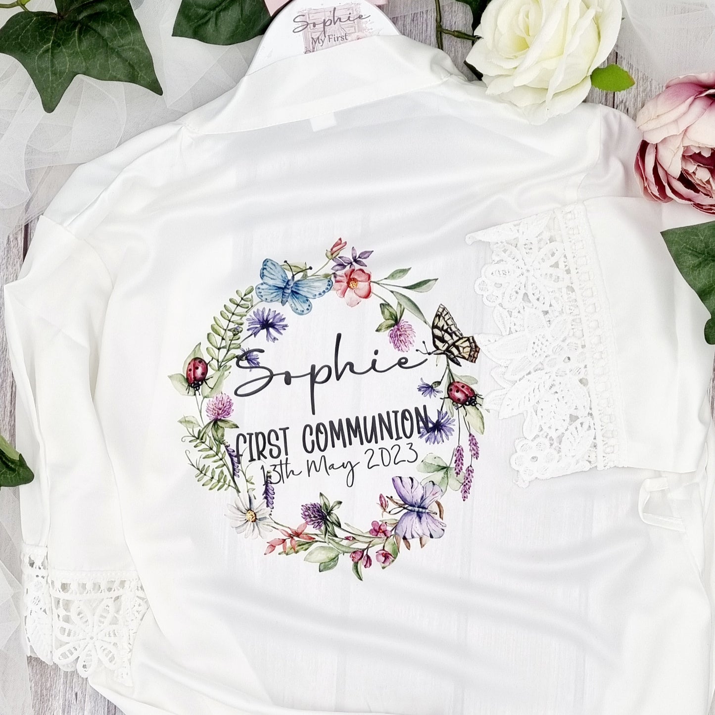 Personalised First Communion robe with colourful butterfly wreath design, child's name and date.