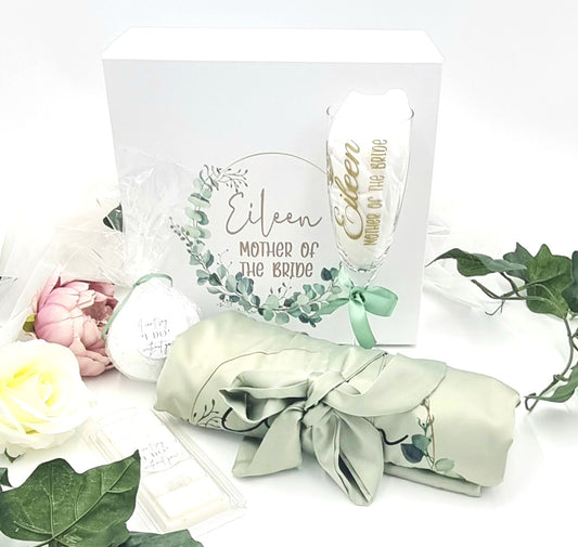 Heavenly scent gift set with white personalised luxury gift box with eucalyptus wreath design and matching sage green robe, bath bomb and wax melt. 