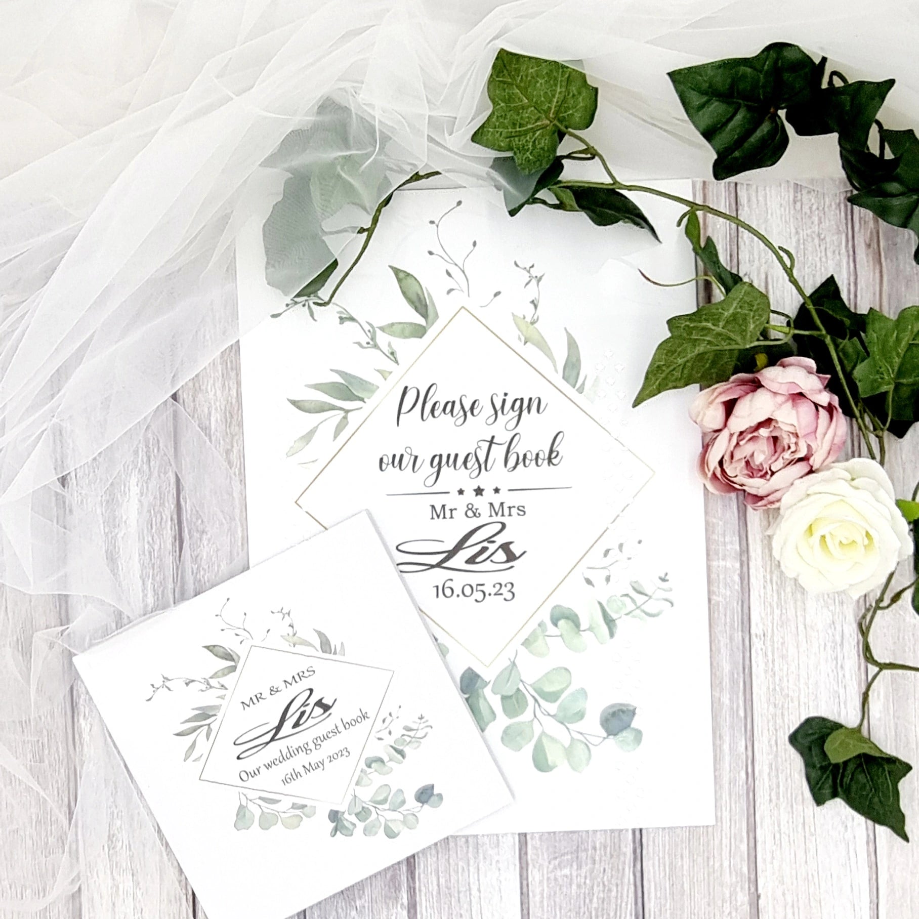 Beautiful personalised wedding guest book with eucalyptus wreath design and couples names and wedding date along with matching A3 Acrylic Sign 