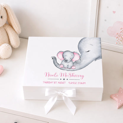 White keepsake box sitting on a white dresser in a nursery with a baby and mum elephant image and personalised with baby's details. 