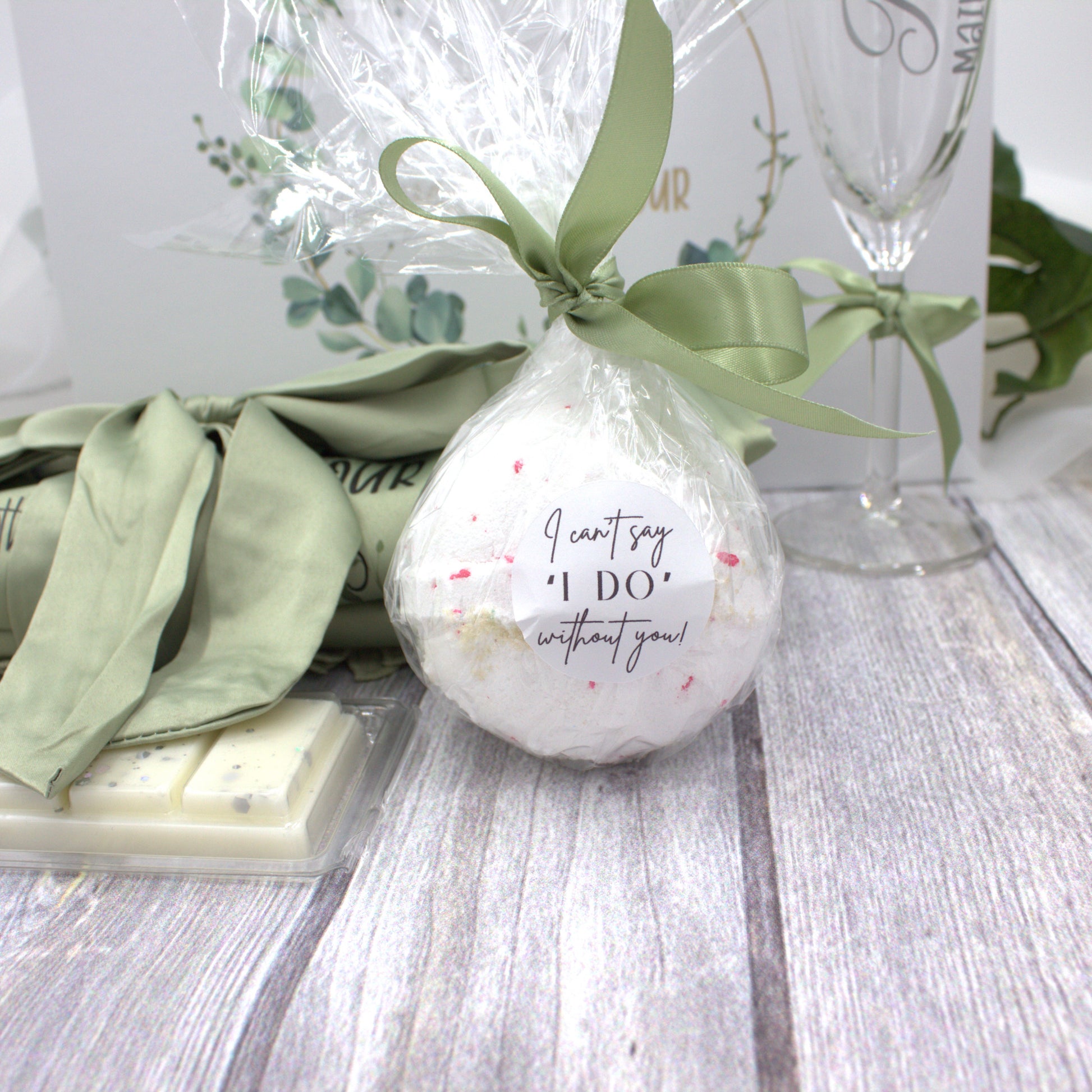 Bath bomb with sage green ribbon