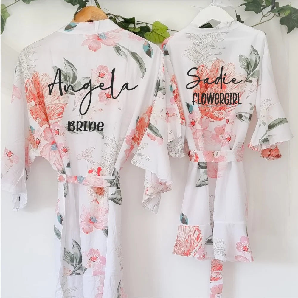 Matching personalised floral satin robes for bride and flowergirl with pink and green floral print — designed and finished in Ireland by HanaLee Studios