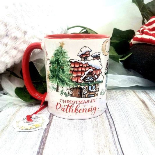 Personalised Christmas place-name mug with festive design and red handle