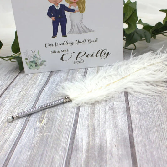 White feather pen for signing the wedding register or your guest book.