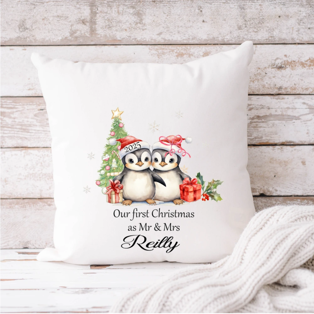 White velvet personalised “Our First Christmas as Mr & Mrs” cushion featuring penguin couple, Christmas tree and custom family name – Irish made.