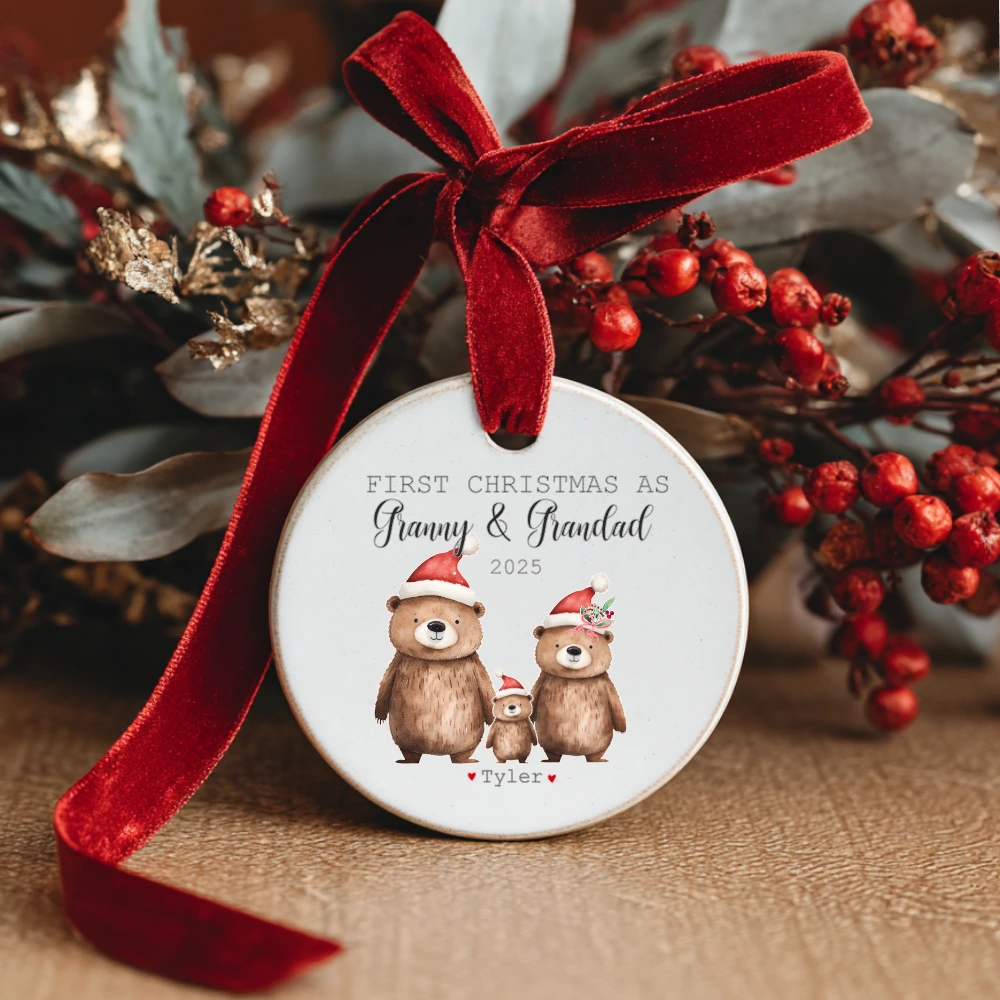 Personalised ceramic Christmas bauble with festive bear family design and text “First Christmas as Granny & Grandad” – handmade Irish gift with optional gift box.