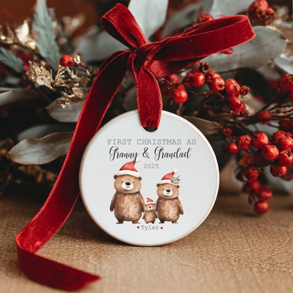 Personalised ceramic Christmas bauble with festive bear family design and text “First Christmas as Granny & Grandad” – handmade Irish gift with optional gift box.