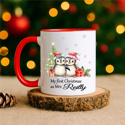 Mug with red handle reading “My First Christmas as Mrs [Name]” with penguin couple illustration – personalised Christmas mug handmade in Ireland.