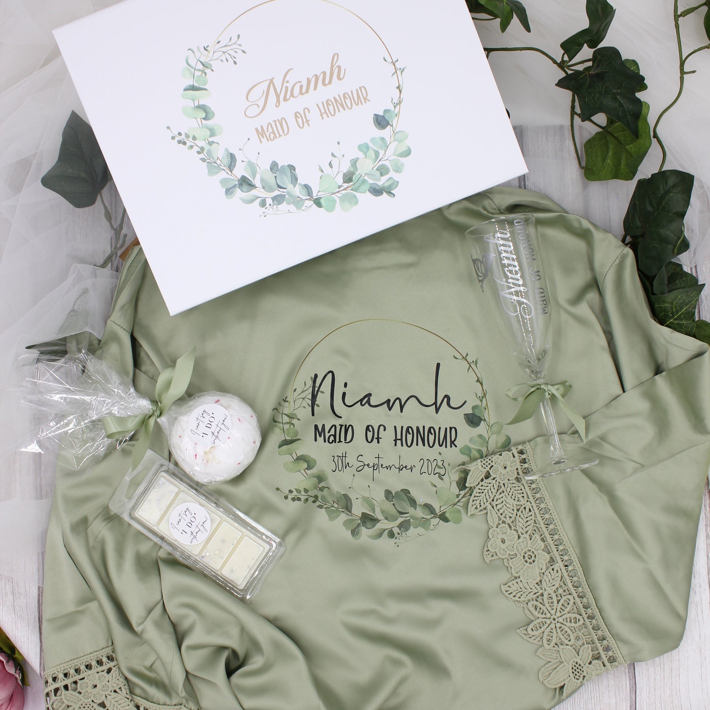 Heavenly scent gift set with white personalised luxury gift box with eucalyptus wreath design and matching sage green robe, bath bomb and wax melt. 