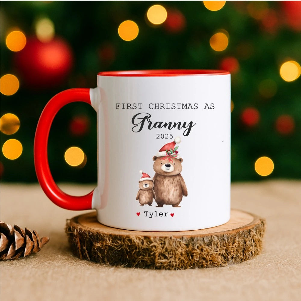 Mug with Christmas design and text on a wooden coaster with blurred lights in the background