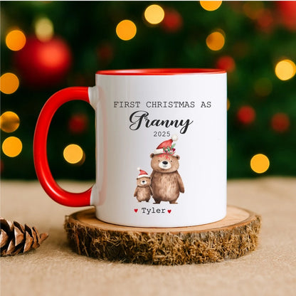 Mug with Christmas design and text on a wooden coaster with blurred lights in the background