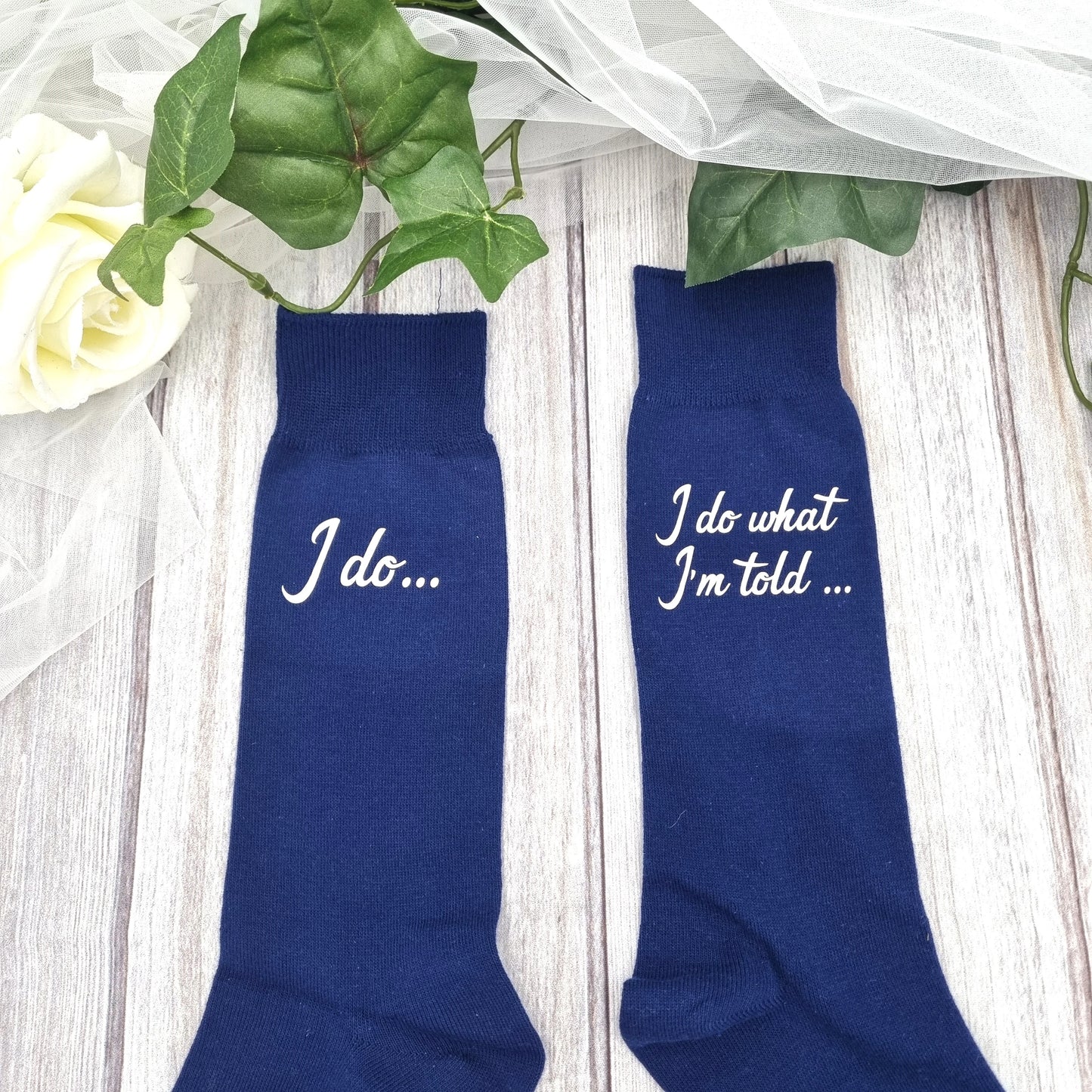 Black and navy groom socks with 'I do' printed on one sock and 'I do as I'm told' on the other, perfect personalized wedding gift for the groom