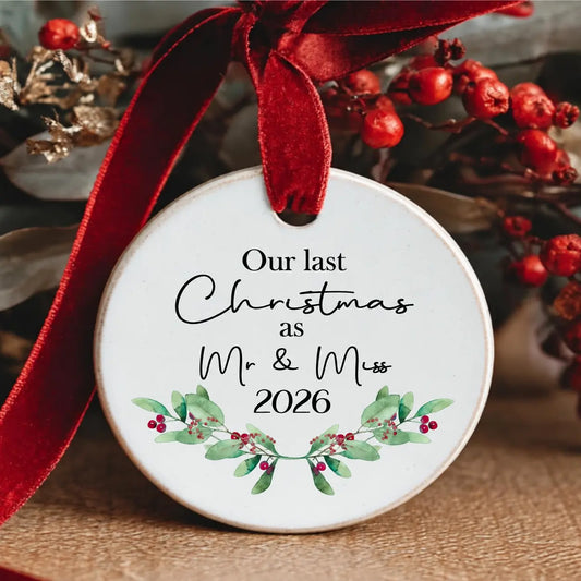 Personalised ceramic bauble with greenery design and text “Our Last Christmas as Mr & Miss 2025” – also available as Mr & Mr or Miss & Miss.