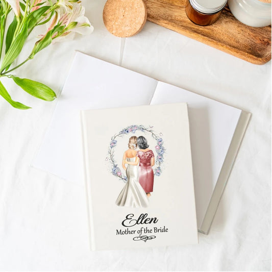 White notebook with image of bride and her mum on the front with the title and mothers name. 