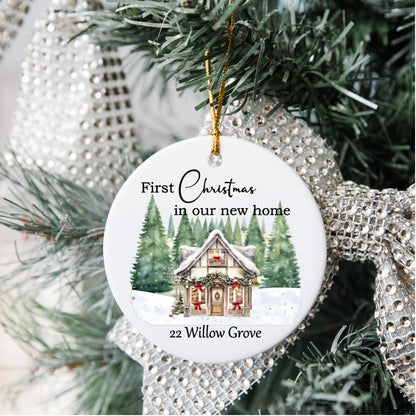 White ceramic Christmas decoration reading first Christmas in our new home with address. 