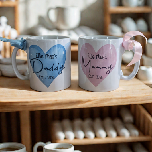 Personalised matching Mammy and Daddy mugs with pink and blue hearts, baby's name, and established date – custom gift for new parents