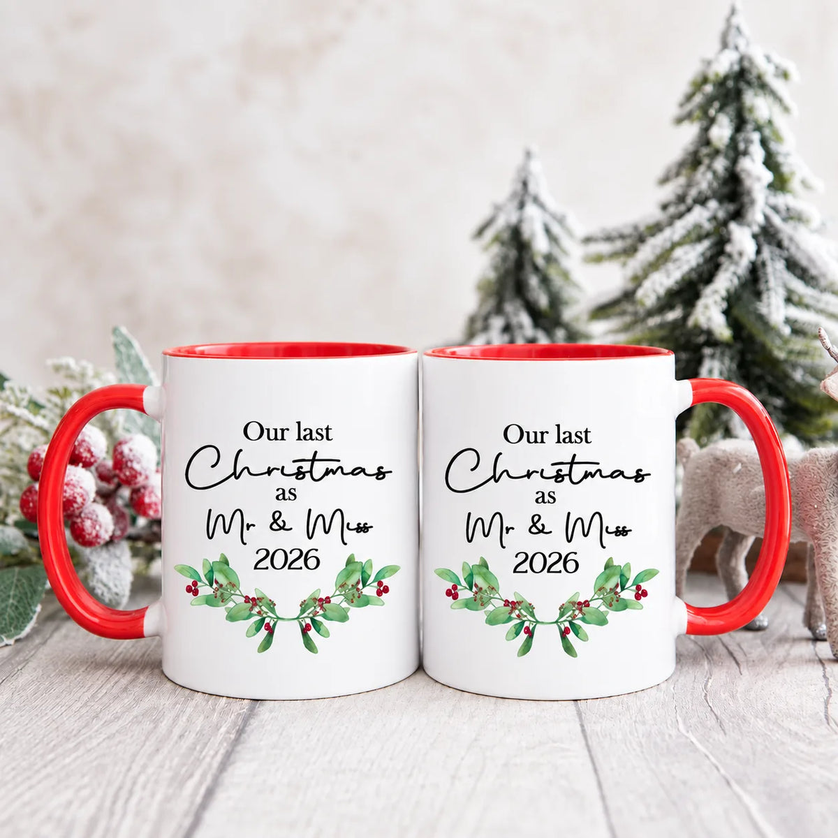 Personalised Our Last Christmas as Mr & Miss 2026 mug set with red handles, festive greenery and red berry design.