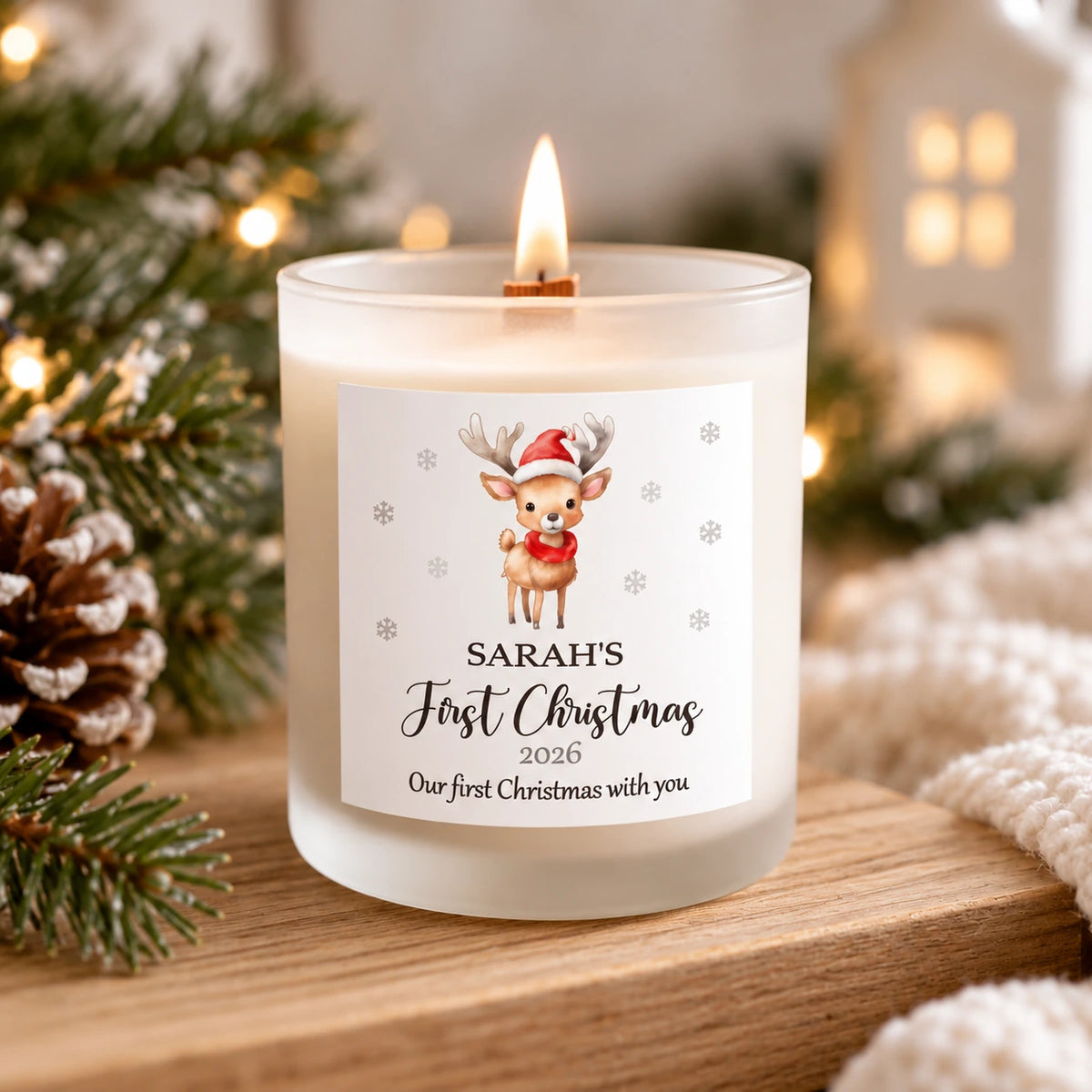 Personalised Baby's First Christmas 2026 soy candle in frosted glass with white label featuring a cute Christmas reindeer, baby's name and festive decorations. Handmade in Ireland 