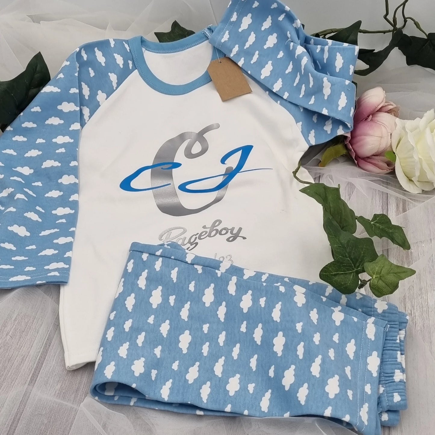 Personalised blue cloud print pageboy pyjamas with custom name and date, printed and finished in Ireland by HanaLee Studios.