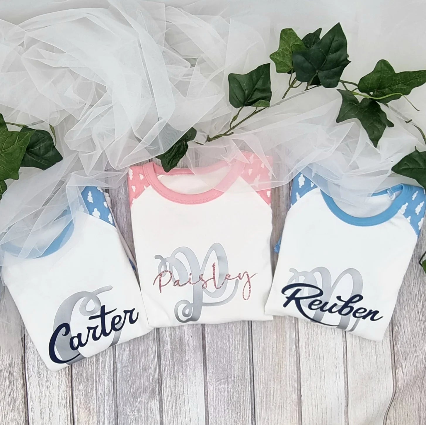 Personalised blue pageboy pyjamas with white cloud print sleeves, customised with name and date, printed and finished in Ireland by HanaLee Studios.