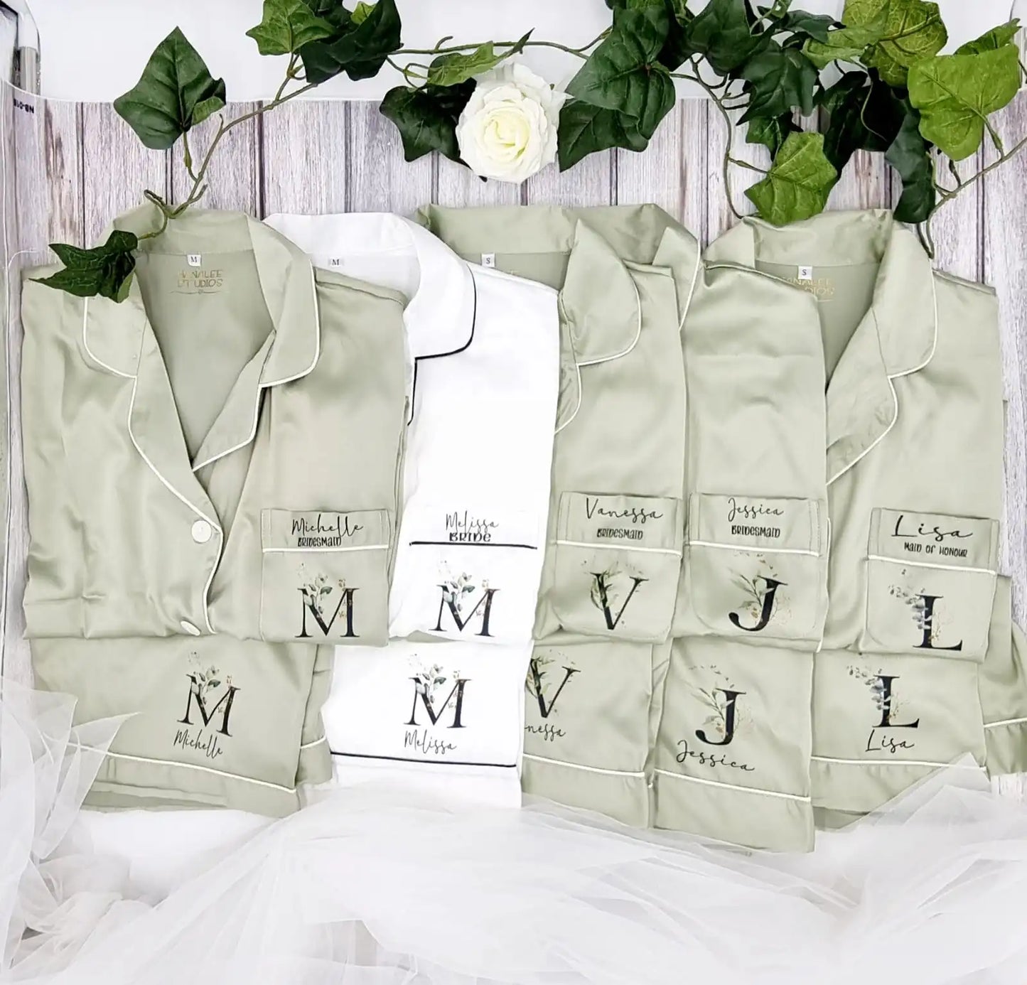 Matching personalised bridal party pyjama sets in sage green and white with custom names and initials Ireland