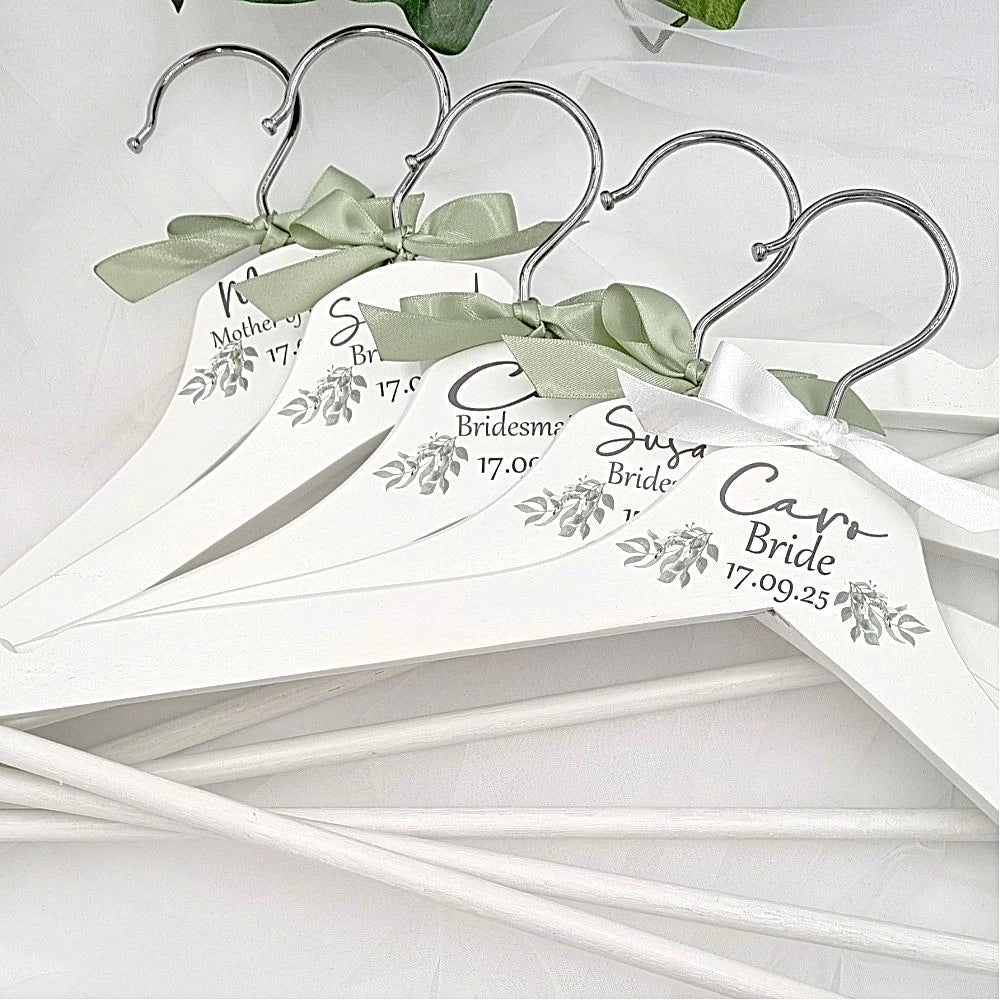 Close up detail of personalised wedding hangers with names for bride and bridesmaids