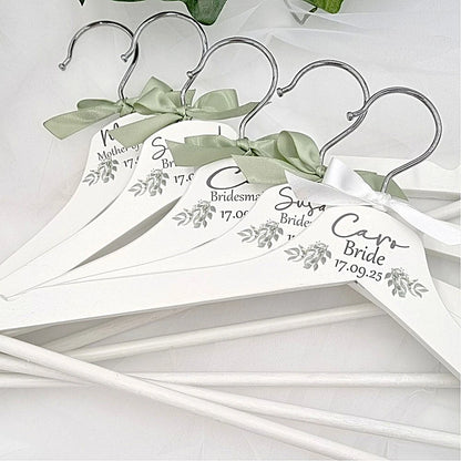 Close up detail of personalised wedding hangers with names for bride and bridesmaids