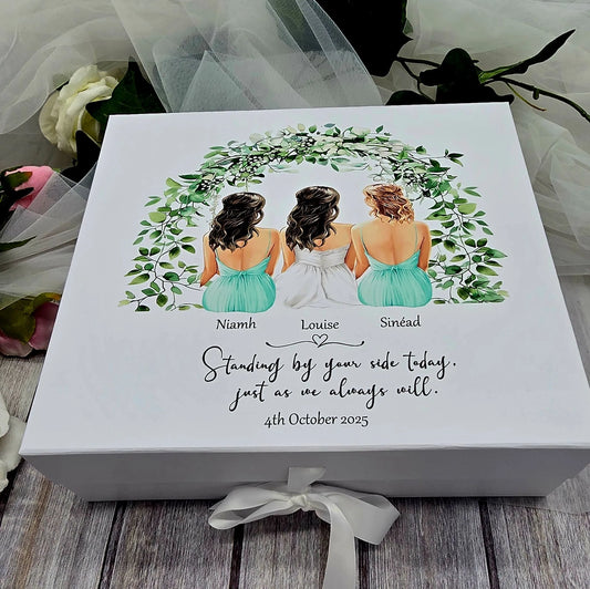 Personalised bride and bridesmaid keepsake box with illustrated bridal party under green foliage wreath, custom names and wedding date, white magnetic gift box with ribbon, Irish wedding gift.