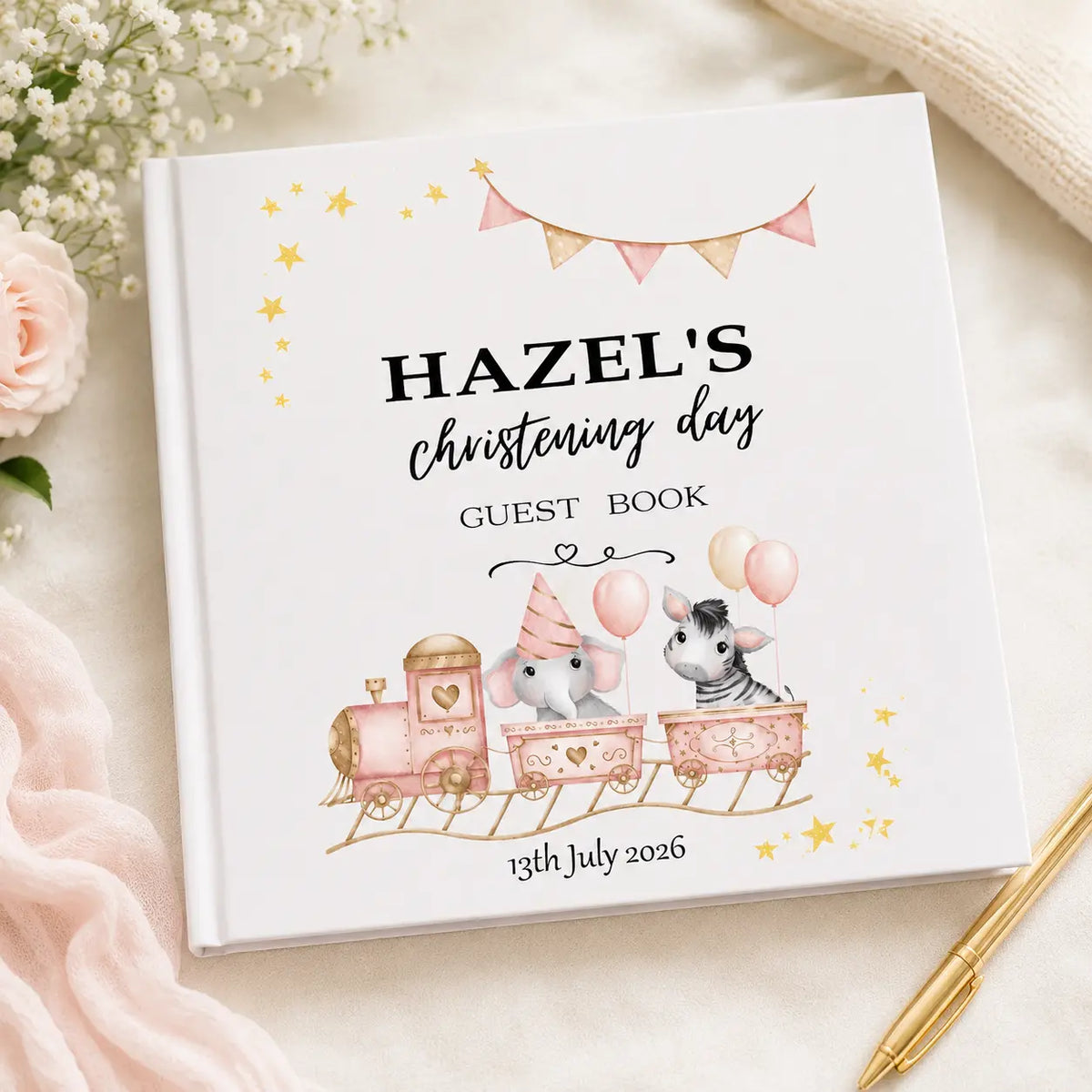 Personalised white christening guest book featuring an animal train with elephant and zebra, gold stars and christening date.