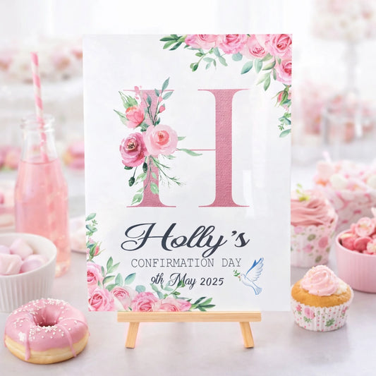 Personalised A3 confirmation welcome sign with floral initial and dove design, displayed on a wooden easel, Irish made by HanaLee Studios
