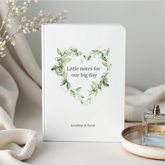 Personalised engagement gift wedding planning notebook with botanical heart design and couple’s names