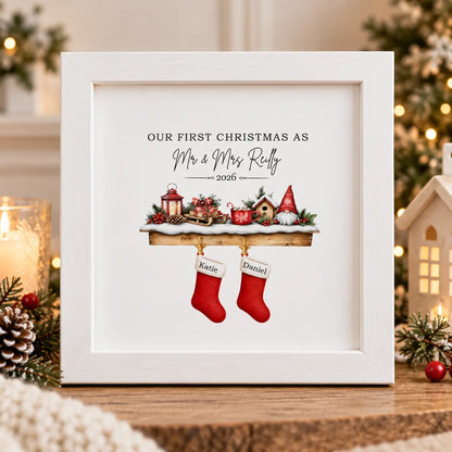 Personalised First Christmas married frame with couple’s surname, year and individual Christmas stockings, displayed in a square white wooden frame.