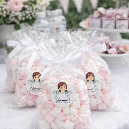 Personalised first communion stickers shown on a clear bag of sweets at a first communion party. 