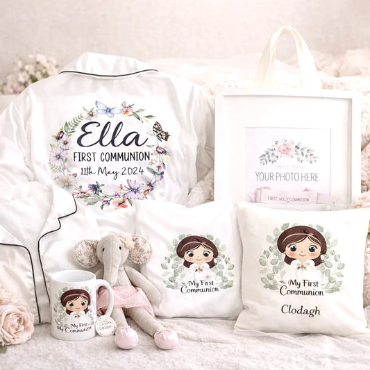 Personalised First Communion gift set including embroidered white pyjamas with name and date, matching cushion, mug, keepsake photo frame and soft toy, beautifully styled in soft pastel tones – Irish made communion keepsake bundle.