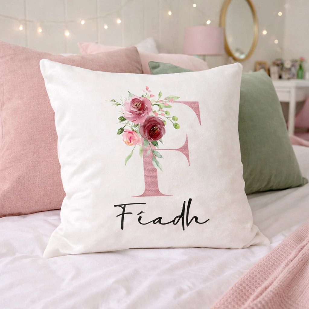 personalised white velvet cushion with floral initial F and name Fiadh on a pink and green teenage bedroom bed Ireland