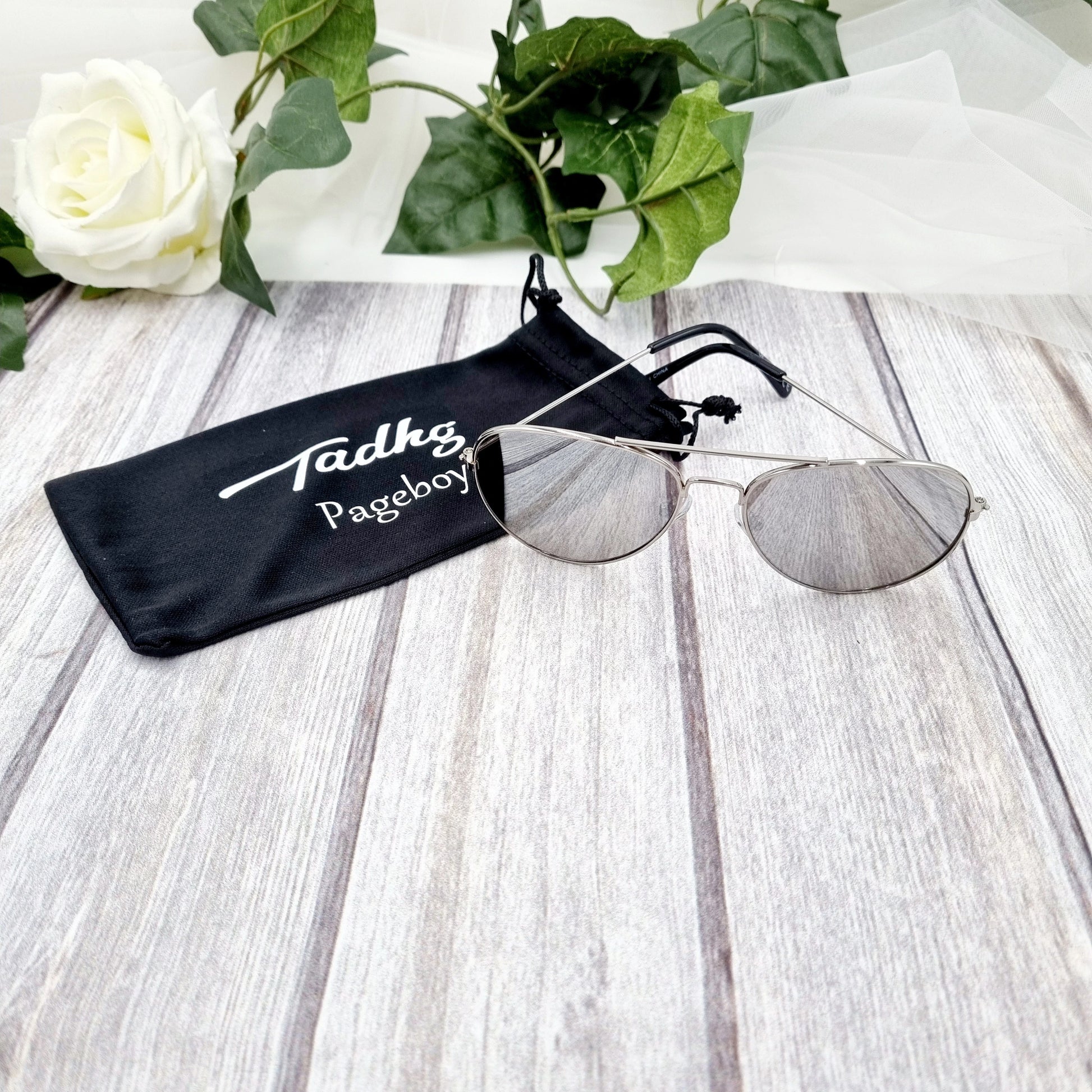 Black personalised page boy sunglasses customised with a child's name for a wedding day gift and keepsake