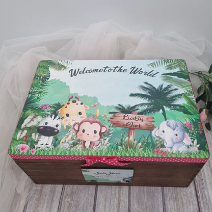 Personalised wooden baby keepsake box with safari animals design, pink ribbon trim and baby girl details on lid, perfect newborn memory chest gift.